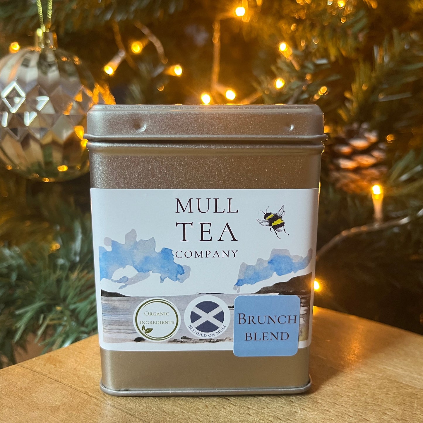 Mull Tea Company tea canister with Christmas tree in the background